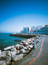 Scenic view of sea against clear blue sky