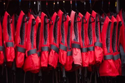 Life jackets hanging side by side