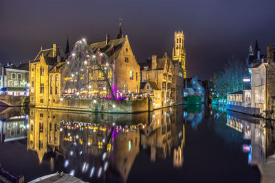 Illuminated buildings in city at night