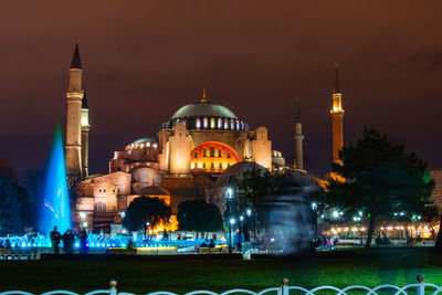 Illuminated buildings in city at night