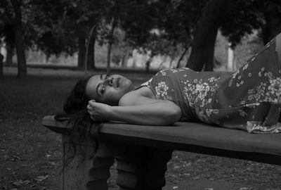 Portrait of woman relaxing on bench