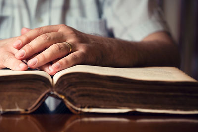 Close-up of hand holding book