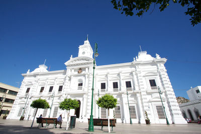 Low angle view of building against blue sky