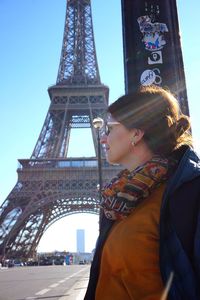 Low angle view of woman tower against sky