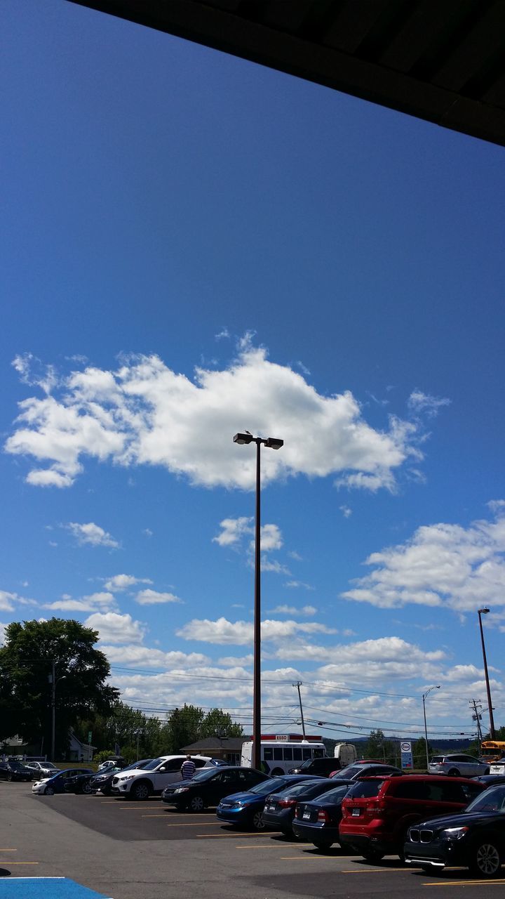 blue, sky, low angle view, cloud, nature, architecture, built structure, day, building exterior, outdoors, reflection, no people, city, electricity, mast