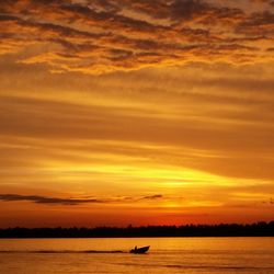 Scenic view of sea at sunset