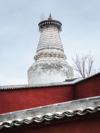 Low angle view of statue against sky
