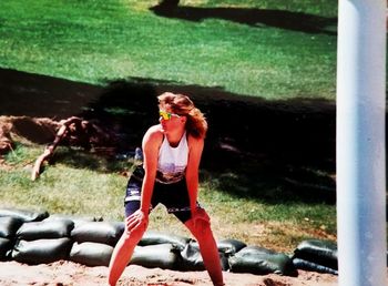 Young woman sitting on grass