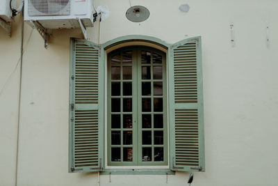 Close-up of closed window of building