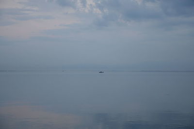Scenic view of sea against sky at sunset