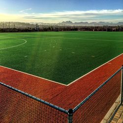 Scenic view of soccer field against sky