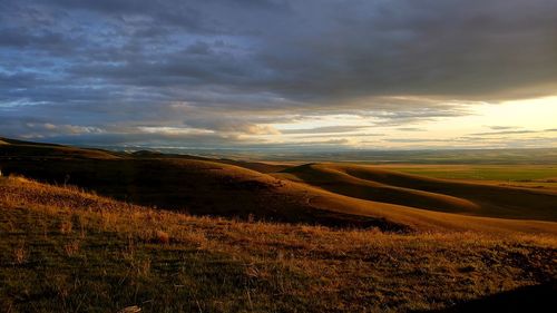 Rolling hillsides glow in the evening sun 