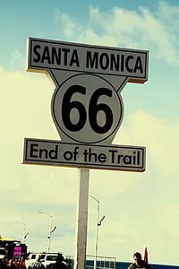 Low angle view of information sign against sky