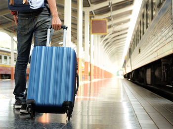 Man walking at railroad station platform