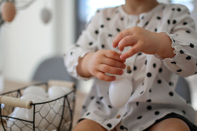 Midsection of woman playing chess