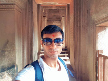 Portrait of young man wearing sunglasses