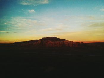 Scenic view of mountains against sky during sunset