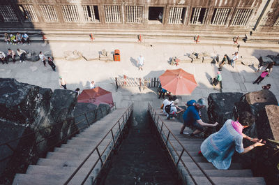 High angle view of people walking on sidewalk
