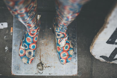 Low section of woman standing on floor