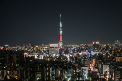 Illuminated buildings in city at night