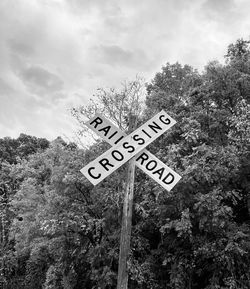 Black and white railroad crossing sign