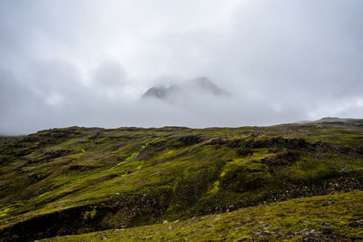 Cloud-shrouded mountains around borgarfjordur eystri in eastern iceland