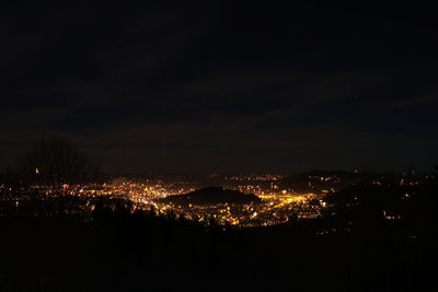 High angle view of illuminated city buildings at night