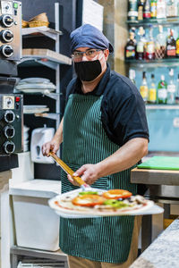 Midsection of man holding food