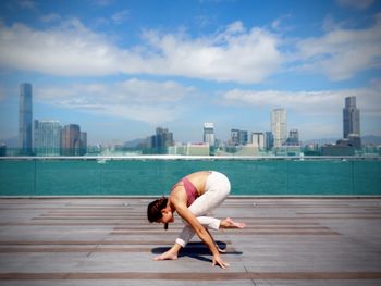 Woman doing yoga in the city