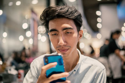 Portrait of man using mobile phone