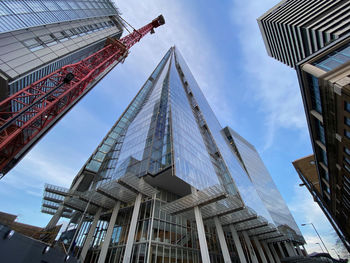 Low angle view of modern buildings against sky