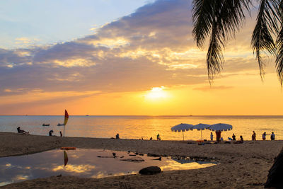 Scenic view of beach against sky during sunset