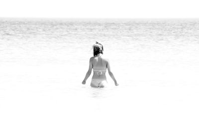 Rear view of woman in sea