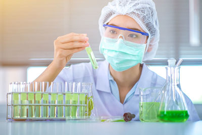 Female scientist experimenting in laboratory