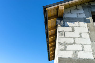 Low angle view of building against clear blue sky