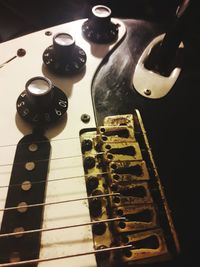 High angle view of guitar on table