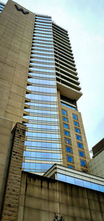 Low angle view of modern building against sky