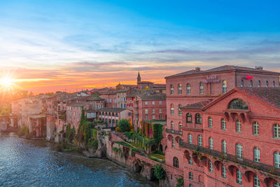 View of buildings against sky during sunset