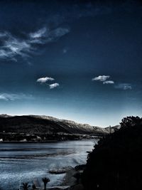 Scenic view of landscape against blue sky