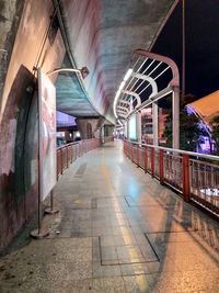 Illuminated corridor in city