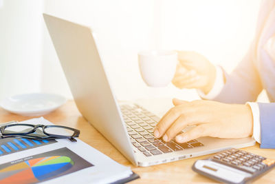 Man using laptop on table