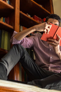 Man sitting on book