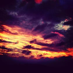 Low angle view of cloudy sky at sunset