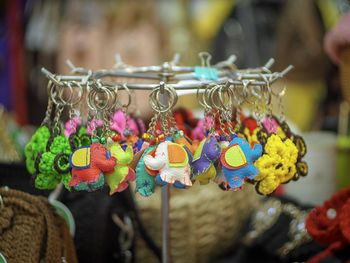 Close-up of multi colored key chains in store for sale