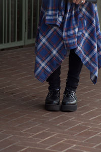 Low section of man standing on floor