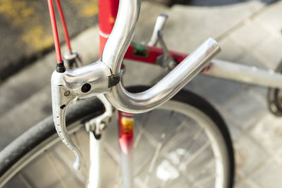Close-up of bicycle on footpath
