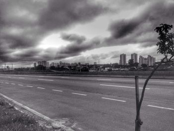 Cityscape against cloudy sky