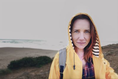 Portrait of woman standing on beach