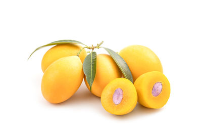 Close-up of oranges against white background