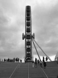 Low angle view of people against sky